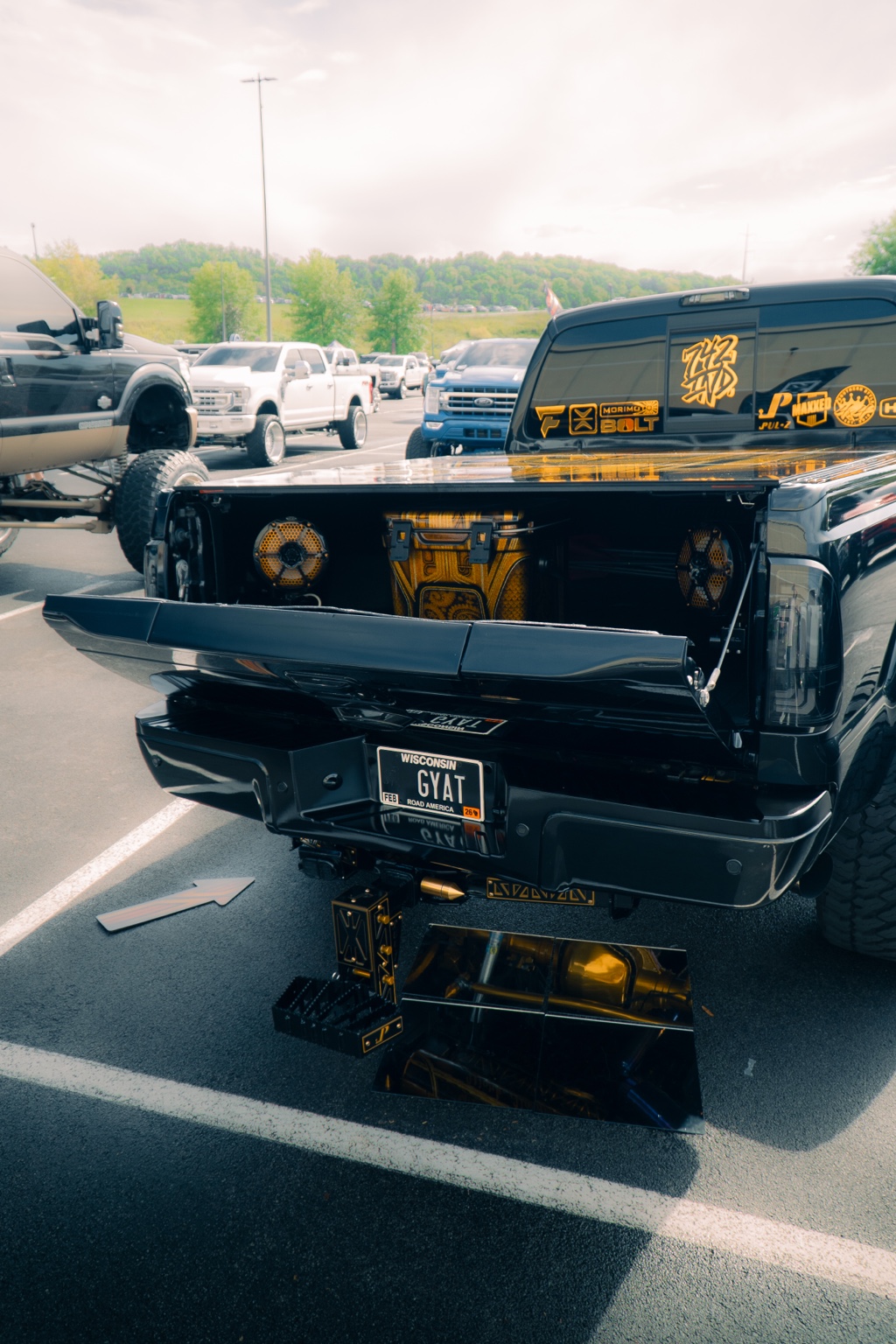 Detailed rear of a black-and-gold truck