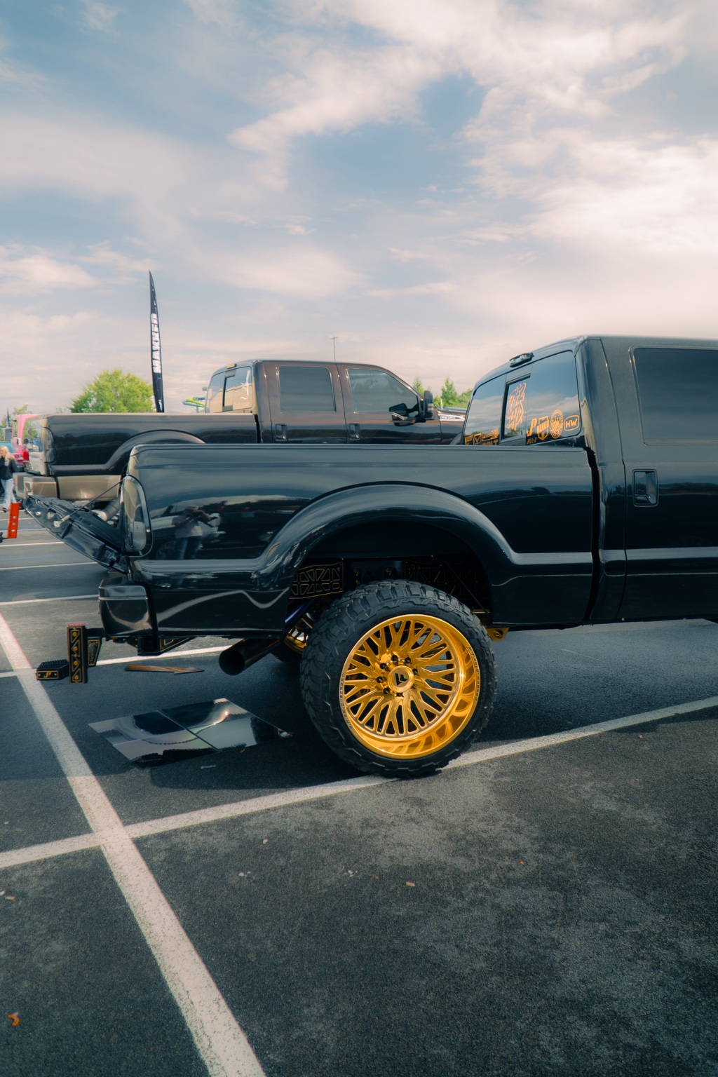 Black lifted truck with gold forged wheels